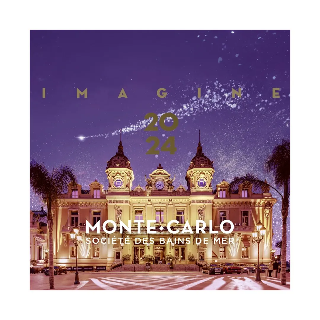 Carte de vœux 2024 de Monte-Carlo Société des Bains de Mer : Casino de Monte-Carlo illuminé la nuit sous un ciel violet, mots Imagine 2024 en lettres dorées